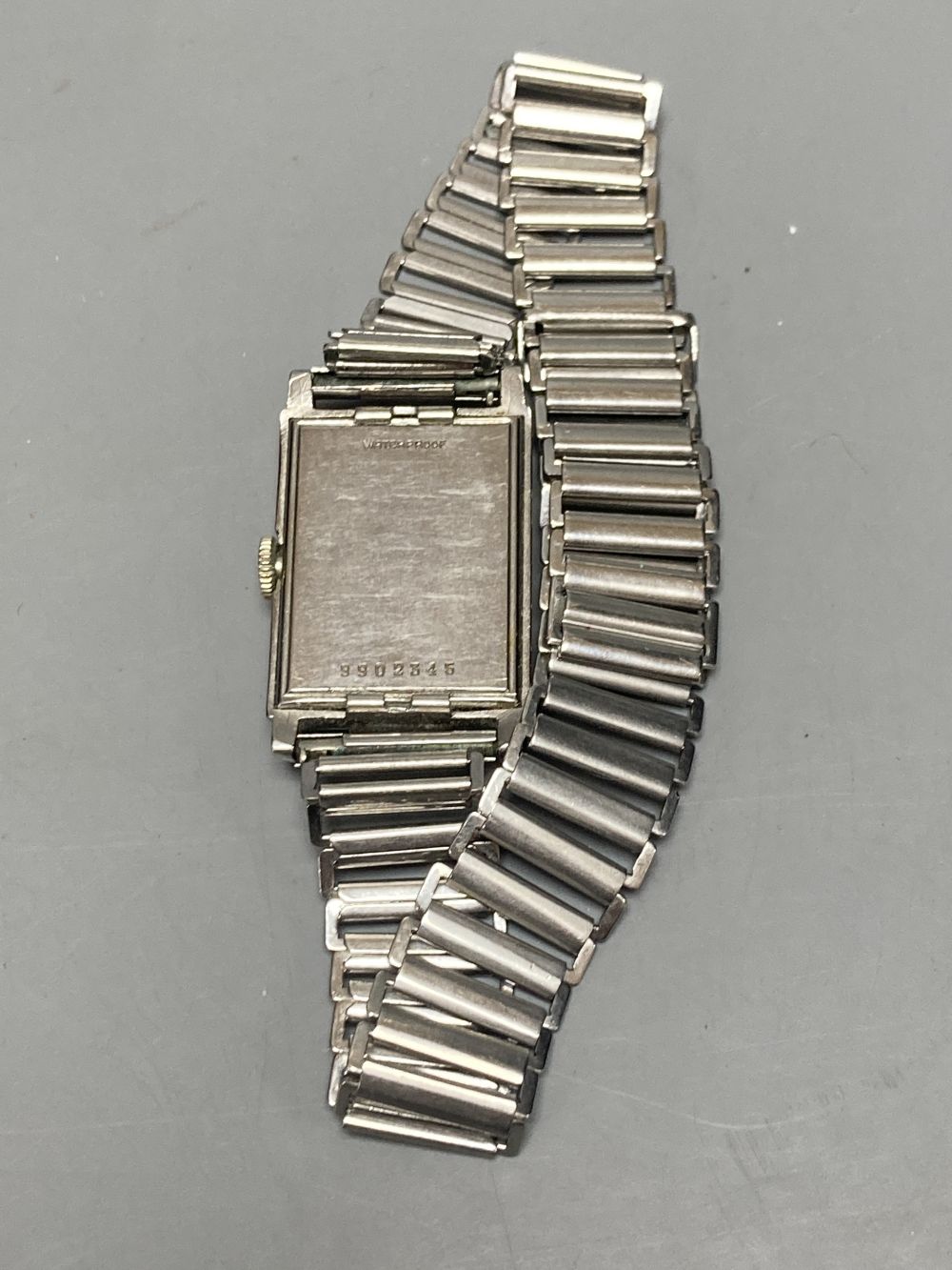 A gentlemans 1940s? stainless steel Omega manual wind wrist watch, with rectangular Arabic dial and subsidiary seconds,